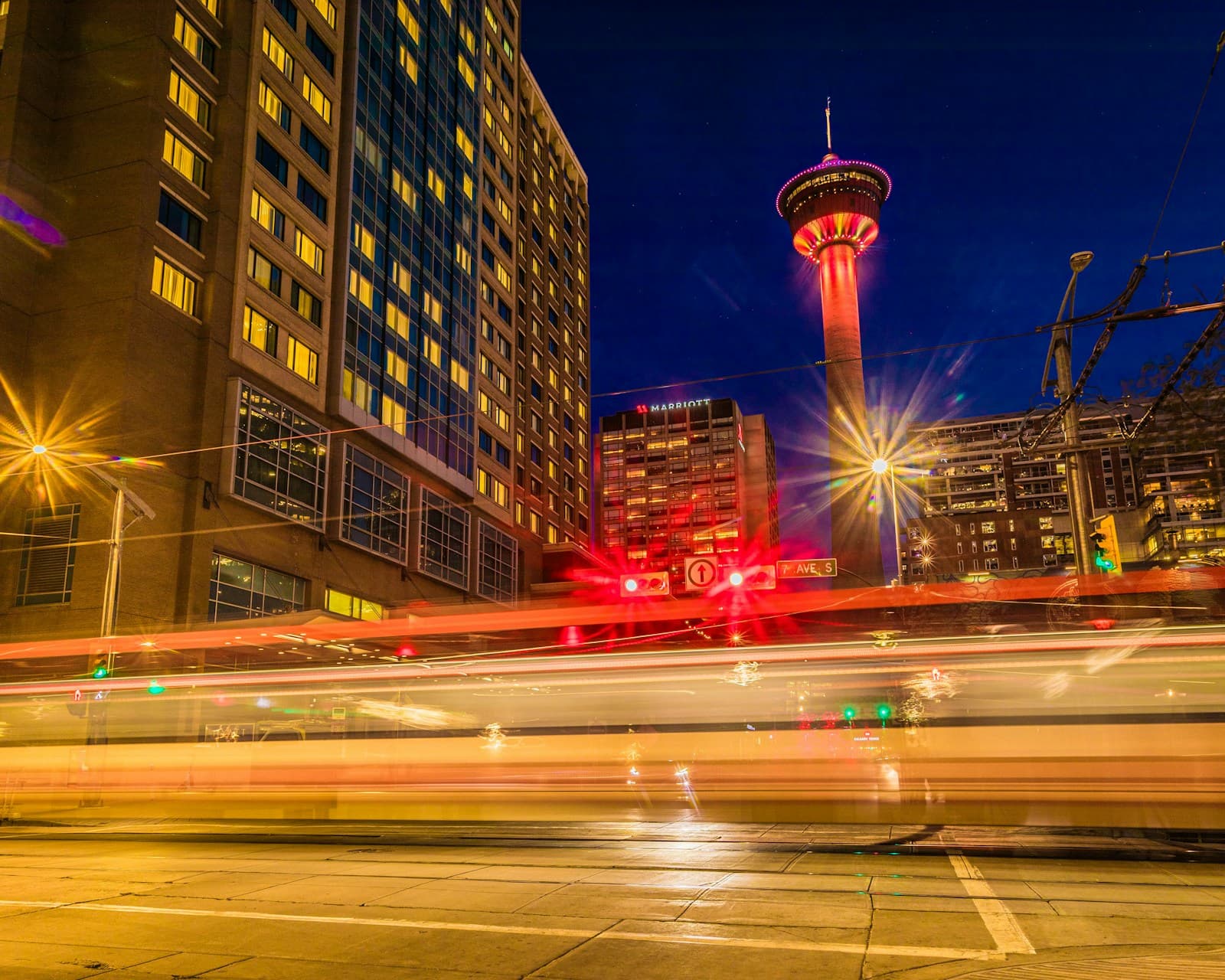Calgary CTrain and downtown street scene at dusk