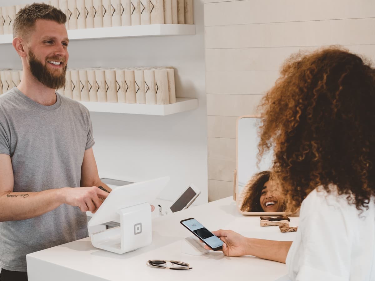 Customer being served at a local business counter