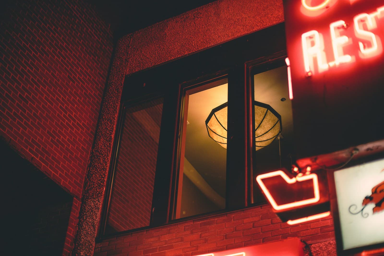 Restaurant exterior and street scene at night in Calgary